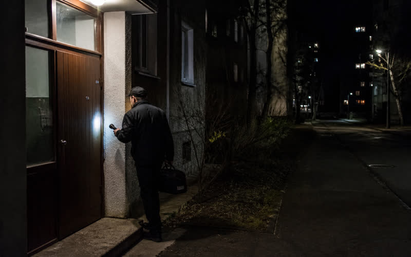 Evening call-out — specialist with a work torch